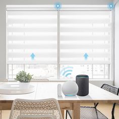 a table with chairs and an amazon echo device on it in front of a window