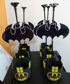 there are some batman cupcakes on the table