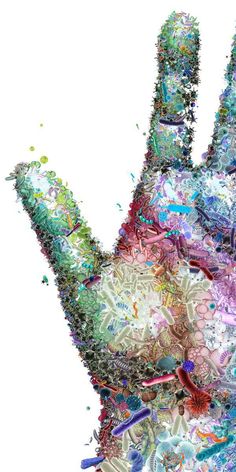 a multicolored hand made out of many different objects