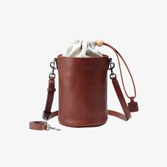 Medium,Brown Brown Bucket Bag For On-the-go, Classic Brown Bucket Bag For On-the-go, Cognac Bucket Bag For On-the-go, Brown Soft Leather Bucket Bag For On-the-go, Cognac Bucket Bag For Everyday Use, Everyday Cognac Bucket Bag, Brown Bucket Shoulder Bag For Travel, Everyday Brown Bucket Bag With Removable Pouch, Everyday Brown Leather Bucket Bag