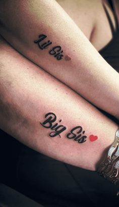 two people with tattoos on their legs that say big sis and little sis, sitting next to each other