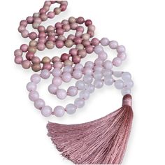 This mala necklace is made with 108 hand-knotted gemstone beads, each measuring 8mm. The gemstones used are Rhodochrosite, Rose Quartz, and White Quartz sure to raise your vibration to give and receive a higher love. Why 108 beads in a traditional mala necklace? Vedic culture viewed 108 as a number of the wholeness of existence. This number also connects the Sun, Moon, and Earth: The average distance of the Sun and the Moon to Earth is 108 times their respective diameters. Also, there are 54 let Spiritual Pink Beaded Necklaces With Natural Stones, Spiritual Hand-strung Pink Beads, Rose Quartz Necklace With Gemstone Beads For Meditation, Spiritual Pink Hand-strung Beads, Pink Spiritual Beaded Necklace With Gemstone Beads, Pink 8mm Beads Jewelry For Meditation, Pink Spiritual Beaded Necklace For Gift, Pink 8mm Bohemian Beads, Rose Quartz 108 Beads Jewelry For Meditation