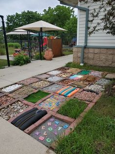 the yard is filled with rocks, grass and other things that have been laid out on it