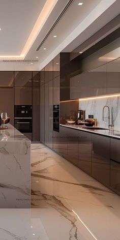 an elegant kitchen with marble counter tops and stainless steel appliances