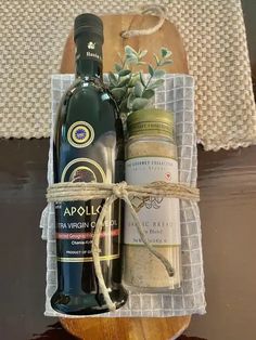 a bottle of wine and some spices in a basket