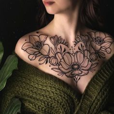 a woman with flowers on her chest