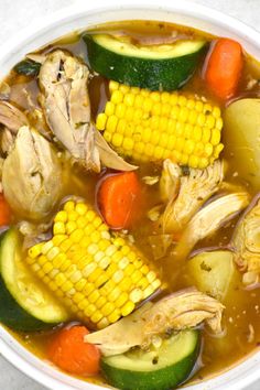 a white bowl filled with soup and vegetables