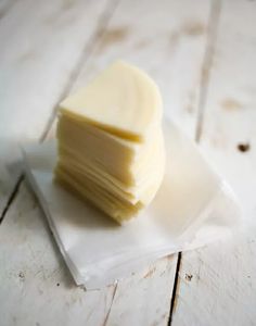 a stack of butter sitting on top of a white plate