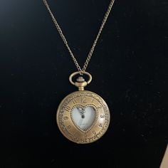 Very Beautiful Golden Vintage Watch Necklace. Press Down To Open The Glass Heart Shape Face. Watch Works Perfectly. It Has Been In My Jewelry Box For Over A Decade. Brand New Battery Added Few Months Ago Hopefully Still Working. Check All Pictures Carefully. From A Home Free Of Smoke Or Pets. Vintage Gold Pocket Watch In Stainless Steel, Metal Pocket Watch With Round Dial For Gift, Metal Pocket Watch With Round Dial As Gift, Metal Pocket Watch With Round Dial, Metal Pocket Watch With Metal Dial As Gift, Timeless Metal Jewelry And Watches For Gifts, Timeless Metal Jewelry And Watches As Gifts, Gold Watches For Valentine's Day, Silver Heart-shaped Watch For Valentine's Day