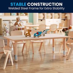 a wooden table with chairs and stuffed animals on it in a playroom for children