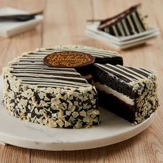 a chocolate cake with white and black frosting