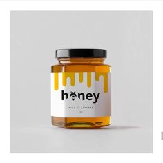 a jar of honey sitting on top of a table