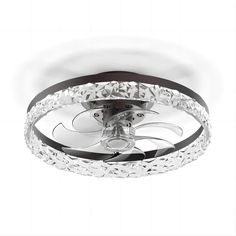 a ceiling light with an intricate design on the top and bottom part of it's lights