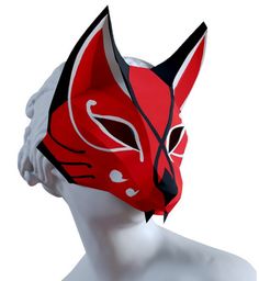 a white mannequin head wearing a red and black mask