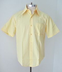 Fantastic find... unworn vintage 1960's light butter yellow short sleeve dress shirt from Macrae Prest. Lightweight, smooth and nicely soft, 65% polyester, 35% cotton, 'Never Needs Pressing'. Features - big dagger point collar - left chest pocket - U-hem APPROXIMATE MEASUREMENTS in inches - lying flat Size:  15-1/2 or Medium Shoulder to shoulder:  19 Chest, armpit to armpit:  23 Waist:  22 Length, center back:  33 CONDITION Excellent, unworn, vintage condition with no wear.  Looks like it was ju Creepy Wedding, Yellow Dress Shirt, Light Yellow Dresses, Pale Yellow Dresses, Yellow Shirt Dress, Rat Pack, Pack Light, Outfit 90s, Summer Yellow