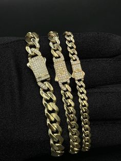 "14k Yellow Gold Monaco Miami Cuban Chain Bracelet Zirconia Box Lock ,6mm, 7mm and 9mm Real 14K Yellow Gold 14k Gold Bracelet, 14k gold Miami Cuban * Metal : Real 14K Yellow Gold, (Properly Stamped, 14K) * Condition : Brand New * Finish : Polished and Ready for wear  * Weight :  * Length : 7, 7.5, 8, 8.5 inches * Width : 6mm, 7mm and 9mm * Clasp/Bail : Box Clasp Lock with cubic zirconia (cz) These Chains made with solid 100% Authentic 14K Gold \"Not Plated or Filled\" This is a Beautiful Genuine Real 14K Gold Miami Cuban Chain and Will look Great on Men & Women. Cuban link chain, Miami Cuban chain, 14k gold Cuban chain, real gold chain, Cuban chain necklace, Cuban chain choker, Mens chain, chunky chain, trendy gold chain, unisex gold chain, yellow gold chain, thick Cuban chain, thin Cuban Yellow Gold Diamond Cut Cuban Link Bracelet Gift, Yellow Gold Cuban Link Bracelet With Diamond Cut, Gold Diamond Cut Cuban Link Bracelet, Diamond Cut Cuban Link Bracelet As Gift, Gold Iced Out Cuban Link Bracelet Gift, Gift Cuban Link Diamond Bracelet With 17 Jewels, Gold Cuban Link Bracelet With Cubic Zirconia, Gold Curb Chain Bracelet With Cubic Zirconia, Cuban Link Diamond Bracelet With Diamond Cut As Gift