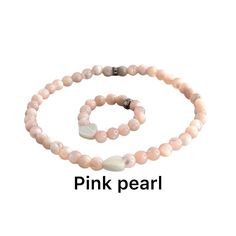 Step into a world of delicate elegance with our "Pink Serenity Set," a stunning combination of a bracelet and ring, each masterfully crafted from radiant 4mm pink Mother of Pearl beads and adorned with a charming white pearl heart. This exquisite set from Bec Sue Jewelry Shop is a tribute to the serene beauty of the ocean, transformed into a wearable symbol of love and grace. Pink Hypoallergenic Necklace For Mother's Day, Adjustable Pink Jewelry For Valentine's Day, Pink Round Beads Jewelry For Mother's Day, Spiritual Pink Jewelry For Mother's Day, Pink Rose Quartz Bracelets For Valentine's Day, Elegant White Pink Opal Jewelry, Valentine's Day Pink Rose Quartz Bracelets, Adjustable Pink Pearl Bracelet Gift, Pink Bracelets For Mother's Day