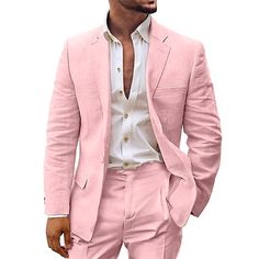 a man in a pink suit and white shirt