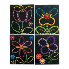 four different colored circles on black paper with dots in the shape of an abstract flower