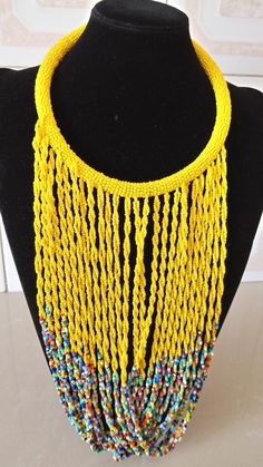 African Fringe Necklace, African Beaded Jewelry, Yellow Beaded Necklace, Tribal Jewelry, Women Necklaces, Mothers Gift, Chunky JewelryThis multi strand necklace is superbly crafted which makes you out stand in any occasion.Main Color - Yellow.Different colors are available.Feel free to send me a convo or e-mail for any clarification or more information.Thank you for visiting, Yellow Beaded Costume Jewelry Necklace, Yellow Choker Necklace With Colorful Beads, Yellow Beaded Choker Necklace For Festivals, Festival Costume Jewelry Beaded Necklace, Yellow Beaded Chain Necklace For Festivals, Yellow Beaded Bib Necklaces With Round Beads, Yellow Bohemian Beads For Party, Bohemian Yellow Beads For Party, Yellow Bohemian Beaded Necklaces For Party