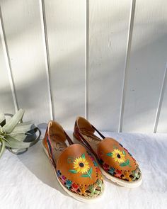 "Woven Mexican Sunflower Sandals/Loafers. Colorful. They feel like leather. Soles look new. Silver stain on the inside of the left upper tongue (please see pictures.) Size Women's: 10. The inside says 7, but the bottoms says 10. Check my measurements. Length of sole: 10 7/8\".  Orders over $35 ship for free. Please check out my Instagram for my newest finds: Hollyshopvintage  Everything priced over $35 has shipping already included in the total price. I'll gladly combine shipping on multiple ite Brown Round Toe Slip-ons For Summer, Summer Flat Slip-ons With Leather Sole, Closed Toe Slip-ons With Rubber Sole For Summer, Bohemian Spring Flats With Round Toe, Spring Bohemian Flats With Round Toe, Bohemian Round Toe Flats For Spring, Beach Slip-ons With Leather Sole And Round Toe, Summer Slip-on Closed Toe Moccasins, Summer Slip-ons With Rubber Sole And Round Toe