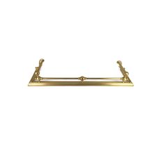 an antique brass towel bar on a white background