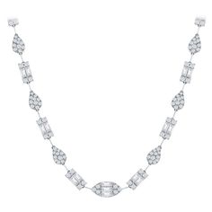 Diamond necklace set with a cluster of baguette and round diamonds to create the illusion of single pear, marquise, and emerald cut shaped diamonds. The necklace is set in 18K white gold. The total weight of the piece is 10.74 carats. The color of the diamonds are F, the clarity is VS1-VS. The necklace is 17 inches in length. Diamond Necklace Set, Diamond Jewelry Necklace, Single Line, Classic Jewelry, Watches Jewelry, Jewelry Necklace, Emerald Cut, Diamond White, Necklace Set