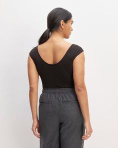 The Supima® Form Cap-Sleeve Tee Black – Everlane Fitted Elastane Top With Scoop Back, Scoop Neck Tops For Workwear, Everlane Stretch Tops, Fitted Seamless Tops With Scoop Back, Casual Fitted Everlane Tops, Everlane Fitted Casual Top, Fitted Everlane Tops For Everyday, Everyday Fitted Everlane Tops, Cap Sleeve Tee