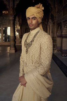 Gold sherwani all over embroidered with all over tonal resham, beads and dabka embroidery. Paired with a solid kurta and a co-ordinating churidar. - Aza Fashions Luxury Sherwani With Gota Work And Traditional Drape, Luxury Ceremonial Sherwani, Luxury Banarasi Silk Sherwani With Zari Weaving, Luxury Banarasi Silk Sherwani With Pallu, Luxury Banarasi Silk Sherwani For Ceremonial Occasions, Bollywood Style Sherwani With Dabka In Traditional Fit, Traditional Fit Sherwani With Intricate Embroidery For Diwali, Diwali Sherwani With Intricate Embroidery Traditional Fit, Bollywood Style Ceremonial Sherwani With Traditional Fit