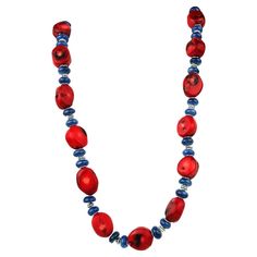 Unique Southwest-Inspired Necklace of Red Coral and Blue Kyanite Elevate your accessory game with this unique Southwest-inspired necklace, artfully crafted with red coral and blue kyanite, and adorned with intricate silvery spacers. This stunning piece seamlessly blends vibrant colors and textures, making it a standout addition to any jewelry collection. Key Features: Vibrant Color Palette: The necklace features deep red bamboo coral, gently faceted to showcase its natural beauty, complemented b Artisan Red Necklace With Polished Beads, Unique Red Gemstone Bead Necklaces, Artisan Red Necklaces With Polished Beads, Unique Single Strand Red Beaded Necklace, Unique Red Single Strand Beaded Necklace, Artisan Red Coral Necklaces For Jewelry Making, Artisan Red Necklaces For Jewelry Making, Unique Red Single Strand Jewelry, Blue Red Coral Jewelry As Gift