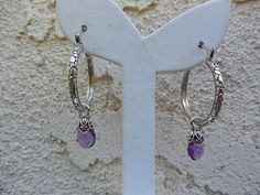 Amethyst hoop earrings 1 1/8" in diameter, cast and antiqued in sterling silver 925 with lever type ear wires, it has 8mm by 12mm amethyst briolettes, capped in sterling silver...from the ear wire to the end of the briolette it is 1 3/4" total...well made earrings Nickel-free Purple Dangle Hoop Earrings, Purple Nickel-free Dangle Hoop Earrings, Adjustable Nickel-free Purple Hoop Earrings, Nickel-free Purple Hoop Earrings, Hoop Earrings Handmade, Moon Studs, To The End, Ear Wire, Ear Wires