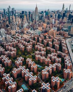 an aerial view of a city with lots of tall buildings in the middle of it