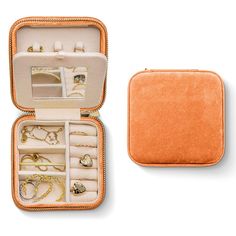 an open case with jewelry inside on a white background