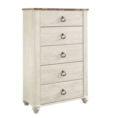 a white dresser with four drawers on it