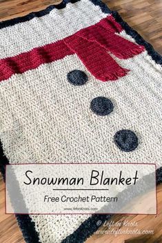 a crocheted snowman blanket is shown on the floor