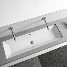 a bathroom sink with two faucets on it