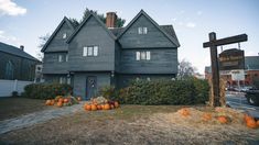 a house with pumpkins in front of it