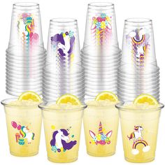 the cups have unicorns on them and are lined up with lemon slices in them