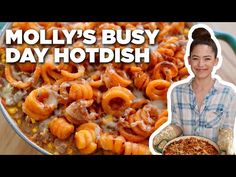 a woman holding a plate of food with the words moly's busy day hot dish