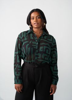 Style#: 5024/P5024 Jazz up your work fit with the Zoela Women's African Print Sheer Blouse in the Black Malachite Geometric print—an African twist to a classic sheer button-up blouse that is sure to add flavor to your wardrobe. Features: Self-lined Buttons at sleeve cuff Pointed collar 100% Polyester​ Sheer, lightweight fabric Designed in the USA, imported Care Instructions: Machine wash cold on gentle cycle with non-chlorine detergent. Hang to dry. Do not bleach. Iron on low. Models: Size: XS H Black Sheer Blouse, Sheer Blouse, Mens Fall, Workout Accessories, Printed Bags, Black Blouse, Womens Fall, Swimwear Accessories, Sweater Jacket