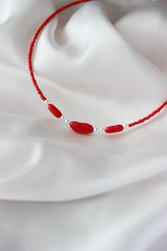 This feminine delicate necklace was made of 3 natural red coral stone beads, 6 white pearl coated pastic beads, tiny red irregular shape glass seed beads, stainless steel end clasps, double strong nylon thread, stainless steel lobster claw and stainless steel adjustable length chain. You can wearing it with other necklaces or alone! The length of necklace is about 41 cm or about 16.1 inches and about 5 cm of adjustable length stainless steel chain. Other necklaces of my shop you can see here: ht Red Beaded Necklaces For Jewelry Making, Red Beaded Necklaces With Heart Beads, Red Pearl Beaded Necklaces For Jewelry Making, Red Minimalist Beaded Necklace With Tiny Beads, Red Pearl Beaded Necklace With Round Beads, Red Pearl Jewelry With Colorful Beads, Red Pearl Necklace With Polished Beads As A Gift, Minimalist Red Beaded Necklace With Tiny Beads, Minimalist Red Beaded Necklaces