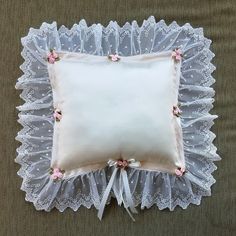 "A sweetly charming silk pillow, perfect for a bedroom. It is made of ivory silk taffeta, with polyester ribbon trims. It has clusters of light pink roses with minty green ribbon leaves. Spot clean only. The pillow itself is approximately 9\" wide by 8 1/2\" tall. With the lace trim, it measures approximately 15\" wide by 14 1/2\" tall." Ribbon Leaves, Light Pink Roses, Rose Pillow, Satin Pillow, Light Pink Rose, Minty Green, Silk Taffeta, Ivory Silk, Silk Pillow