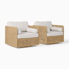 two wicker chairs sitting next to each other