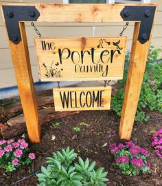 a wooden sign that says the potter community welcomes you and your family to their home