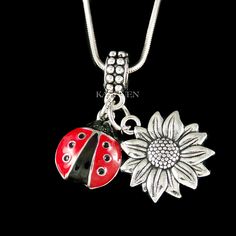 "Want a personalized gift? -Add a Swarovski Crystal Birthstone charm here: https://www.etsy.com/listing/577441131 -Add an Alphabet Initial Letter here: https://www.etsy.com/listing/208545689 You are getting a necklace with two pendants: \"Ladybug\" and \"Sunflower\" . You have an option to add a Swarovski crystals birthstone charm . And you can replace the Snake Chain necklace with lobster clasp to key ring or large stainless steel rhodium plated adjustable bangle (from 67mm to 74mm). The charm Nickel-free Charming Jewelry As A Gift, Cute Flower Jewelry For Gifts, Charming Nickel-free Jewelry For Gift, Nickel-free Charming Jewelry For Gifts, Adjustable Novelty Jewelry For Personalized Gifts, Cute Flower-shaped Jewelry Gift, Handmade Themed Jewelry Gift, Handmade Themed Jewelry For Gift, Cute Customized Jewelry For Gift