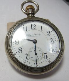 The Hamden John Hancock  antique watch was made in 1898. It is a open face  21 jewel. Has the s/n 1204179. Has 5 adjustments and is rail road grade. Comes with a silverine case and a double sunk dial. The dial where the second had is has a small repair at 3: Oclock. The piece runs but didn't check it for time. The movement has a wonderful engine turning design. Antique Chronometer Watch, Antique Collectible Chronometer Pocket Watch, Antique Round Pocket Watch With Antique Finish, Antique Round Pocket Watch With Subdials, Antique Round Pocket Watch For Anniversary, Victorian Pocket Watch For Anniversary, Antique Pocket Watch With Chronometer For Formal Occasions, Antique Chronometer Pocket Watch For Formal Occasions, Antique Pocket Watch With Chronometer For Formal Events