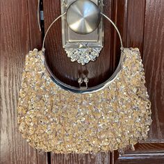 Gold Evening/Cocktail Bag Gold Crystals That Dangle-Silver Trim To Close The Purse/ Inside Fabric To The Purse Is Also Gold. Never Used Silver Evening Bag For Party Season Events, Silver Clutch For Party Season, Silver Evening Bag For Night Out, Silver Evening Bag For Party Season Night Out, Glamorous Silver Clutch For Cocktail, Glamorous Silver Cocktail Clutch, Silver Clutch For Formal Parties, Silver Clutch For Formal Party Season, Silver Clutch For Formal Occasions During Party Season