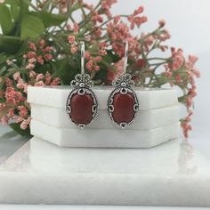 Natural Red Jasper & Sterling Silver Handmade Artisan Crafted Filigree Oval Drop Earrings Matching ring is available https://www.etsy.com/listing/1255431024/natural-red-jasper-silver-ring-sterling?ref=listings_manager_grid Material: 925 Solid Sterling Silver, 925 Stamped Natural Red Jasper Gemstones Dimensions:14 mm x 10 mm, Oval, Cabochon Earrings Length: 1.40 inches Width: 0.50 inches Closure: Ear wire with safety catch Finishing: Oxidized & polished Comes with a free gift pouch and box Free D Nickel-free Red Carnelian Earrings, Ornate Red Sterling Silver Earrings, Artisan Red Jewelry For Anniversary, Red Carnelian Earrings With Ear Wire, Silver Carnelian Earrings For Gift, Handmade Red Sterling Silver Earrings, Red Carnelian Earrings Perfect As A Gift, Artisan Nickel-free Red Earrings, Artisan Red Nickel-free Earrings