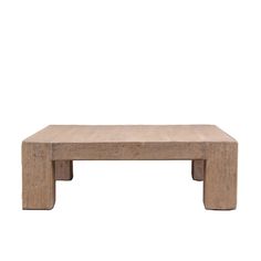 a small wooden table sitting on top of a white wall