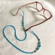 Beaded Glasses Chain - Sky Blue Handmade with beautiful sky blue seed beads, some sparkly beads and a few little silver beads. Are you tired of walking all over the house or garden looking for your glasses? with a pretty glasses chain you'll always know where your glasses are and you'll be adding a touch of bling to your look. Measures 66cm in length   FREE SHIPPING WITHIN AUSTRALIA Follow me on Instagram: https://www.instagram.com/mollyand.frankie/ Made in Byron Bay Blue Beaded Glass Glasses Chains, Blue Beaded Chain Glasses Chains With Round Beads, Blue Beaded Glasses Chains, Blue Glass Glasses Chains With Colorful Beads, Adjustable Blue Glasses Chains With Colorful Beads, Handmade Blue Glass Glasses Chains, Handmade Adjustable Blue Glasses Chains, Blue Glasses Chain With Colorful Beads As Gift, Blue Glasses Chains With Round Beaded Chain